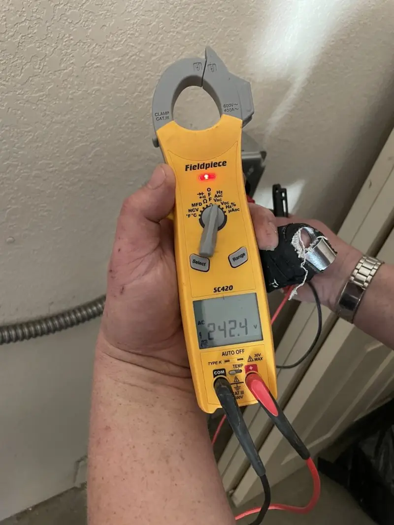 Voltage testing with clamp meter during Outlet Installation in Lake Royale